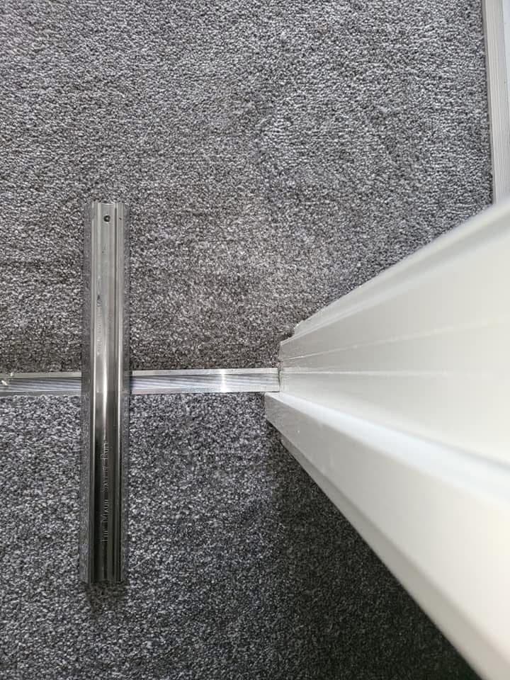 Repaired carpet at corner after treatment