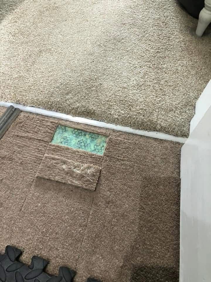 Carpet with patch damage before repair