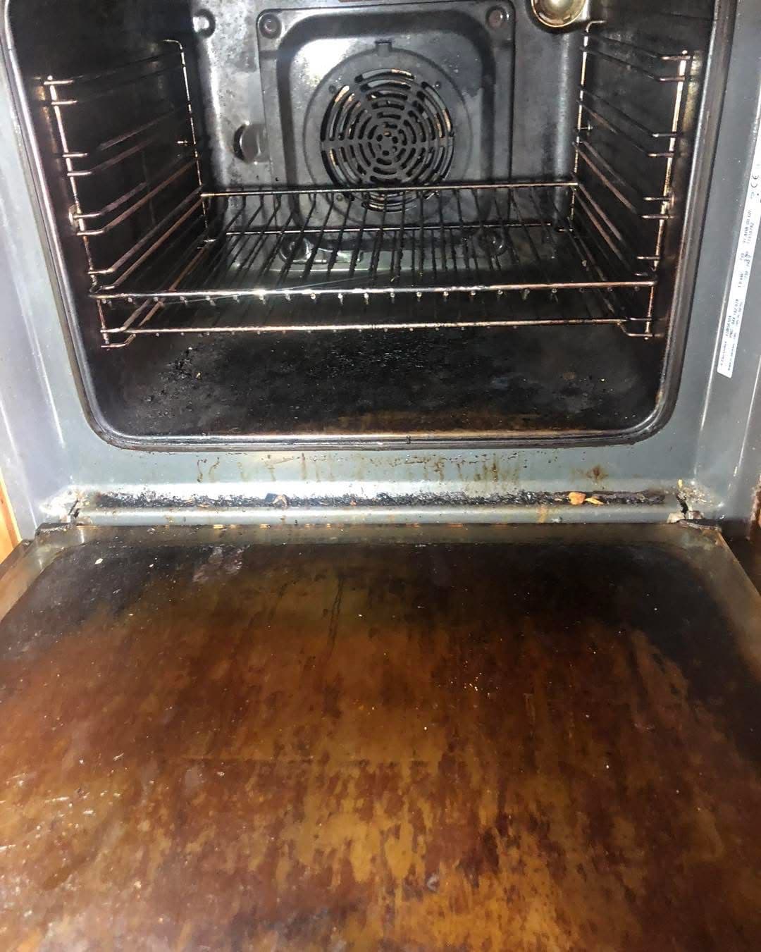 Heavily soiled oven interior before deep clean