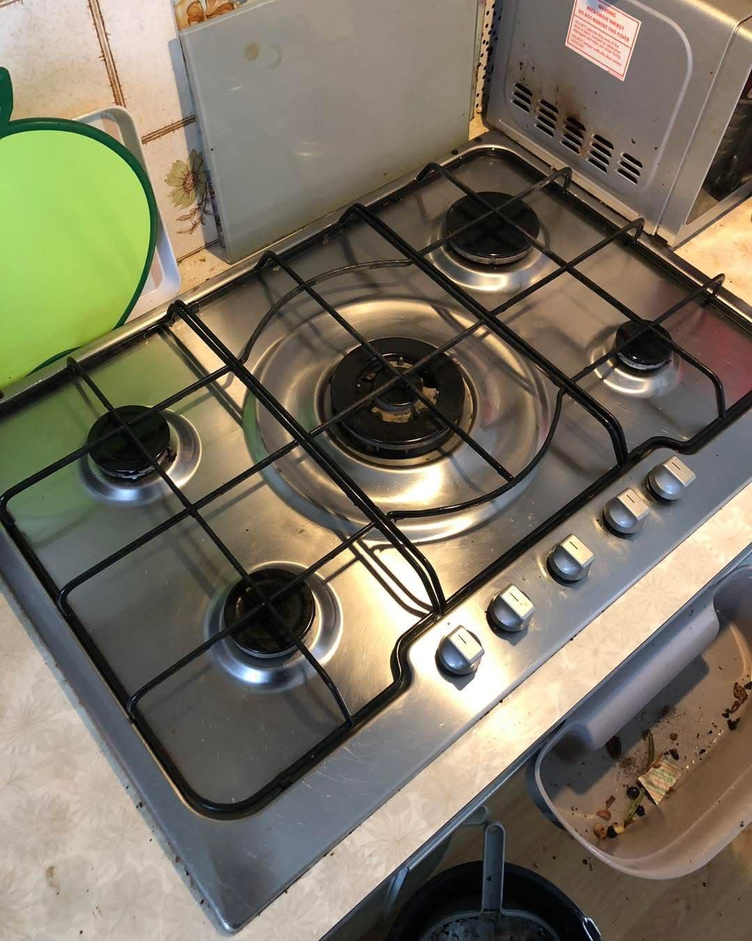 Gleaming stainless steel 5-burner gas hob after professional clean