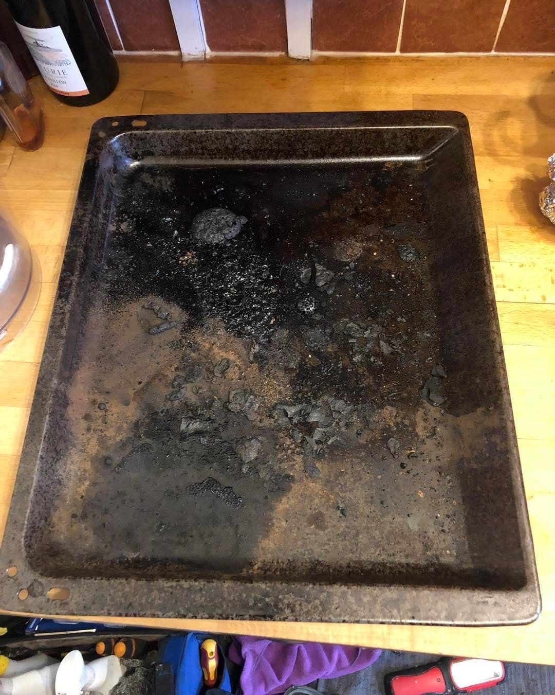 Heavily burnt baking tray before cleaning