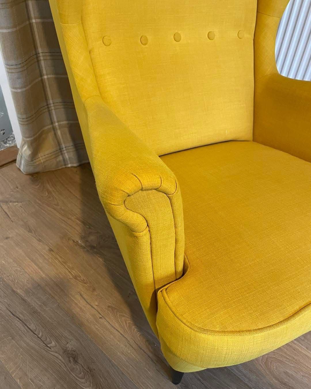 Yellow wingback chair close-up after upholstery cleaning