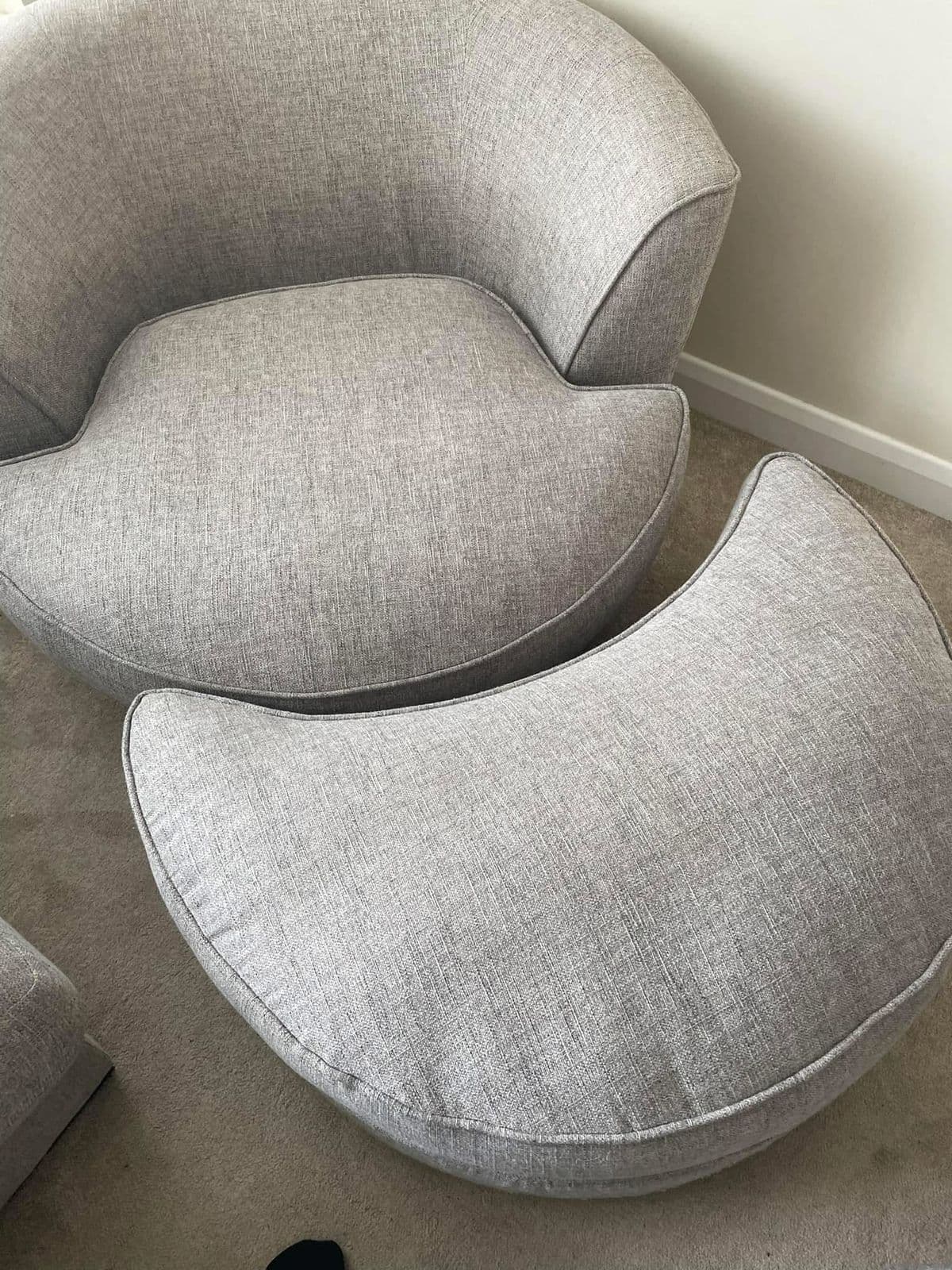 Clean grey round chair and ottoman after upholstery cleaning